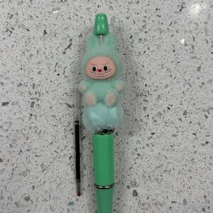 Green Labubu pen with ink refill